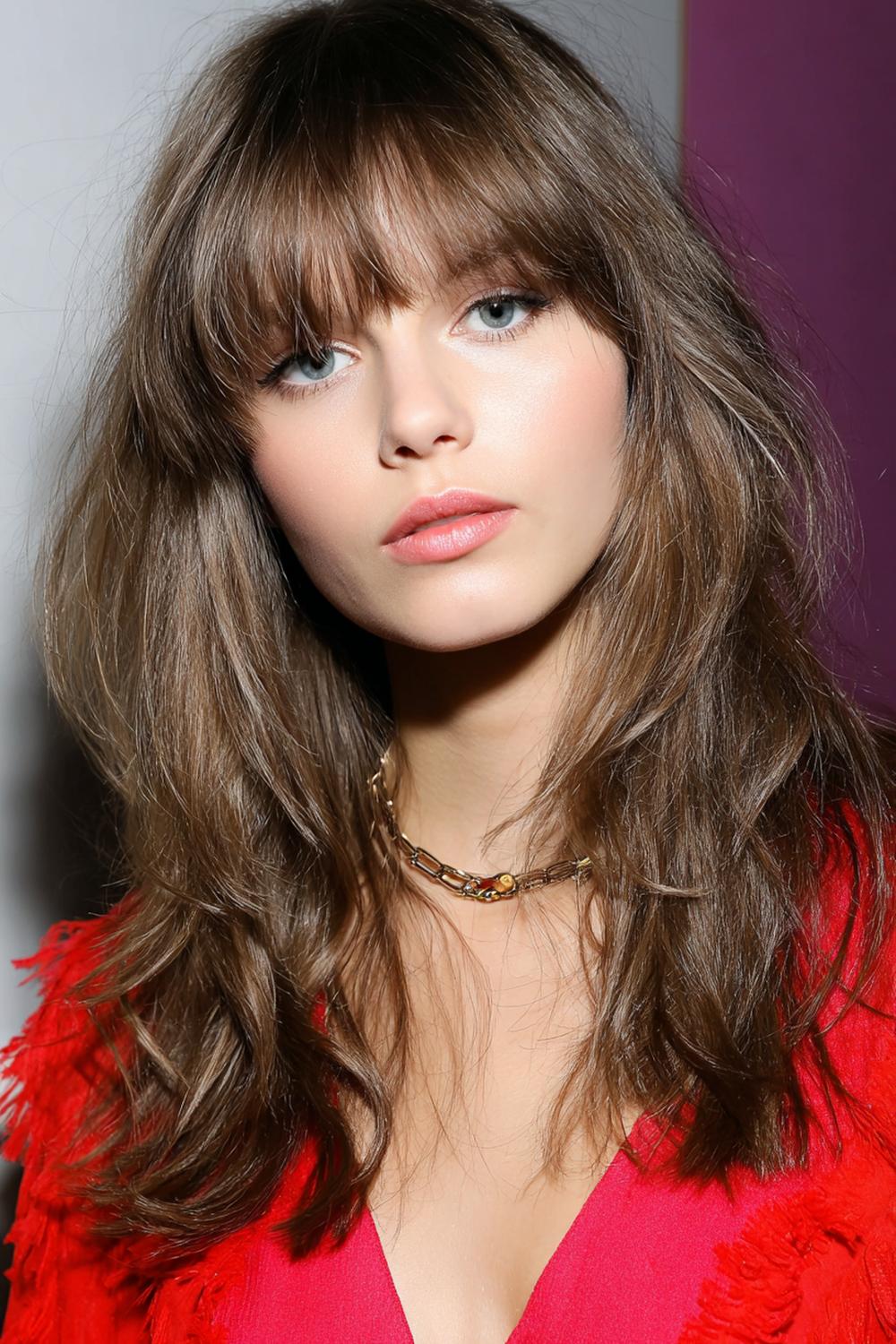 24. Best Hairstyles for 2026: Bangs Hairstyle with Bottleneck Fringe and Long Layers