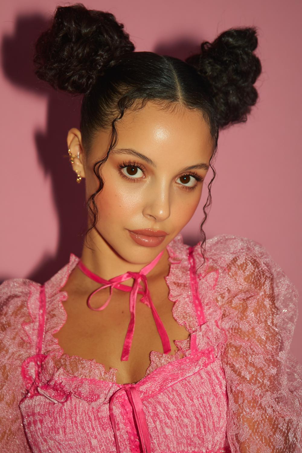 15. Playful Celebrity Inspired Hairstyles 2026 Space Buns with Face-Framing Pieces