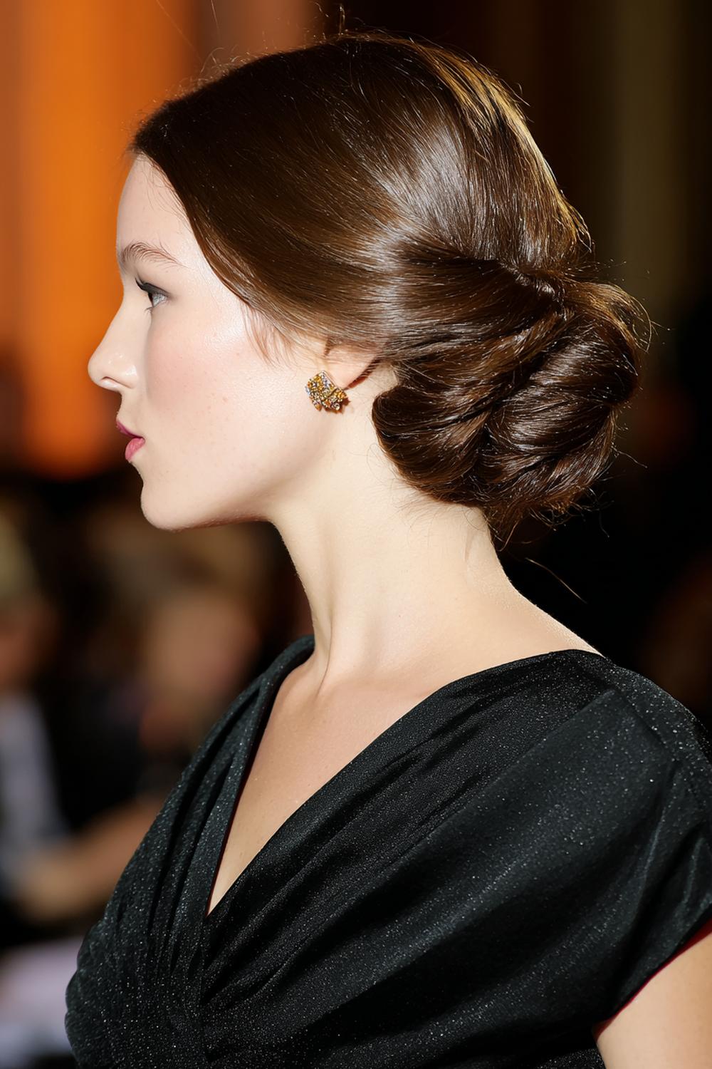24. Elegant Celebrity Inspired Hairstyles 2026 Chignon with Twisted Side Panels
