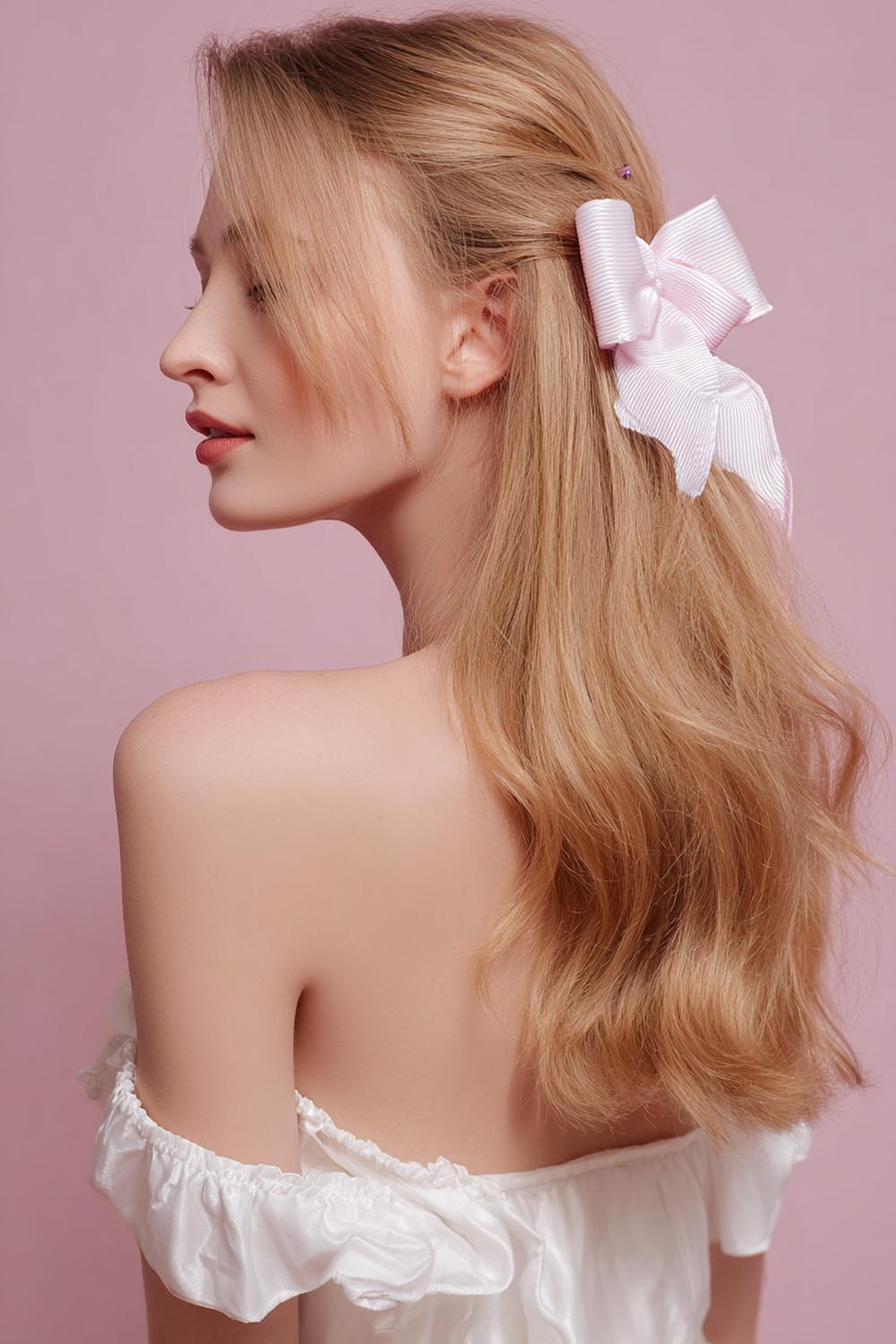4. Half-Up Bow Barrette Hairstyle with Soft Waves and Hidden Pins