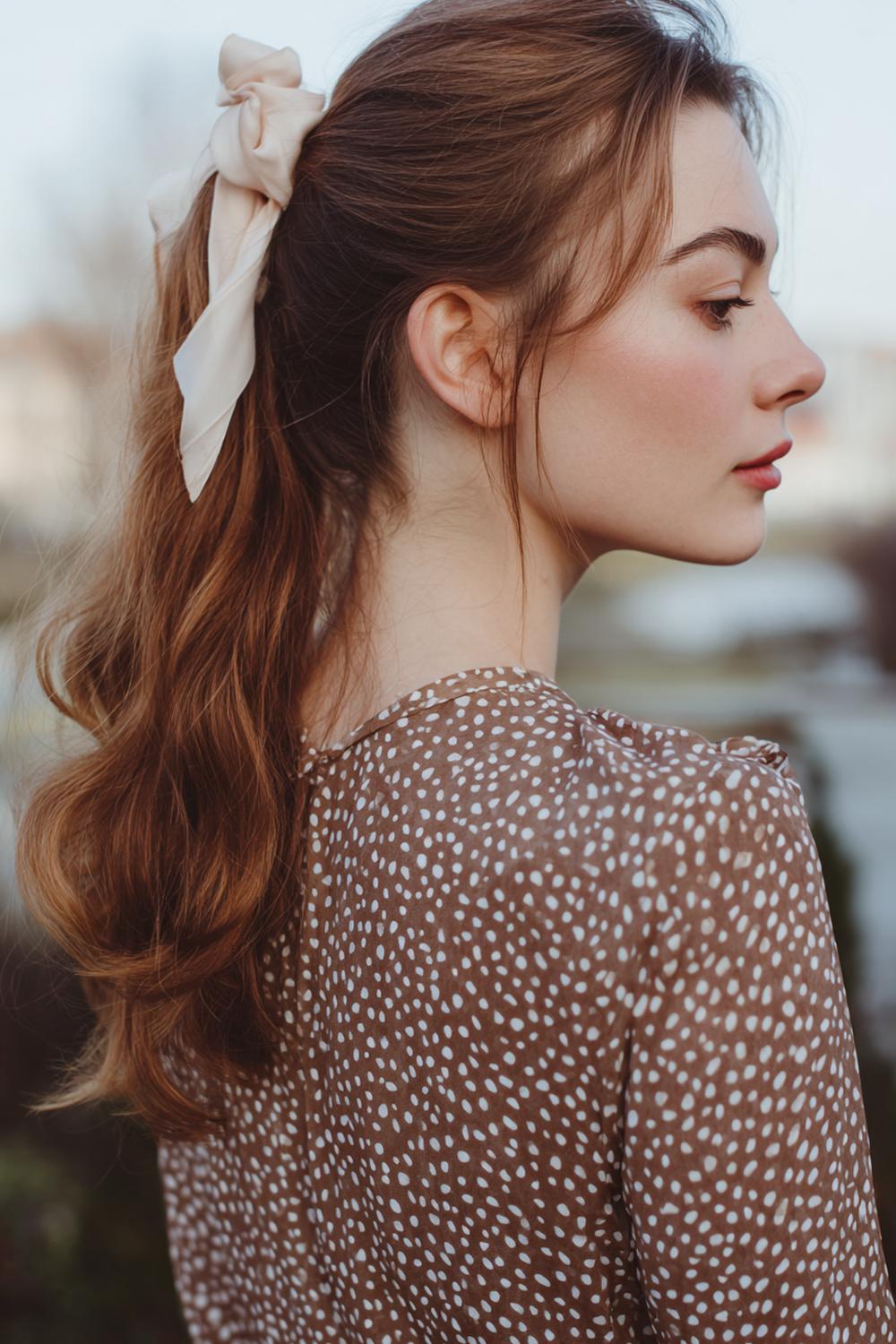 24. Everyday Hairstyles for Women: Side Low Ponytail with Soft Ribbon and Curved Ends