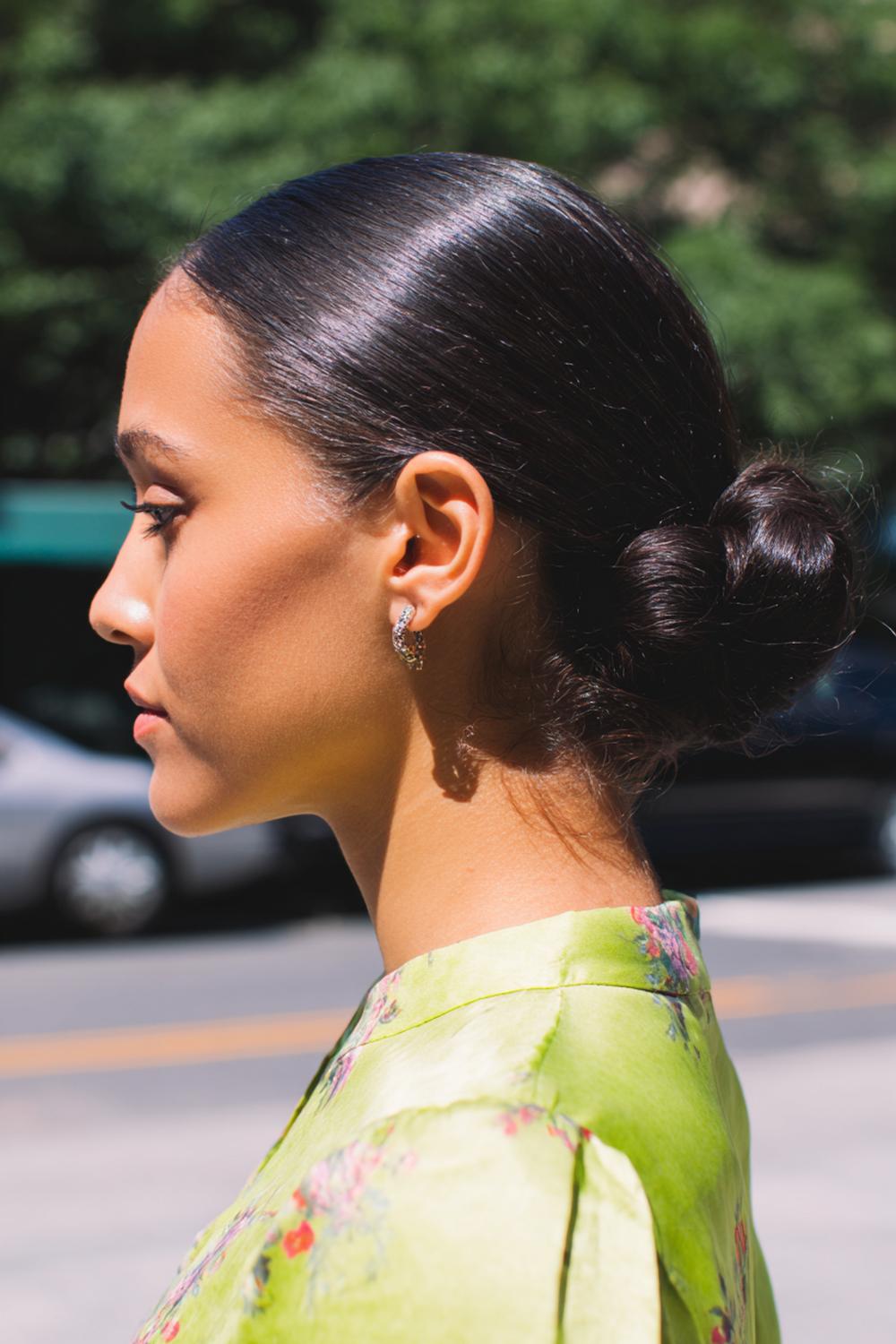 4. Everyday Hairstyles for Women: Center-Part Low Bun with Clean Edges