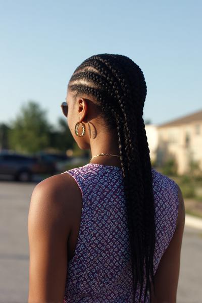 18. Straight-Back Feed-In Cornrows for Hairstyles for Black Women Cornrows With Crisp Lines and Low Bun Finish