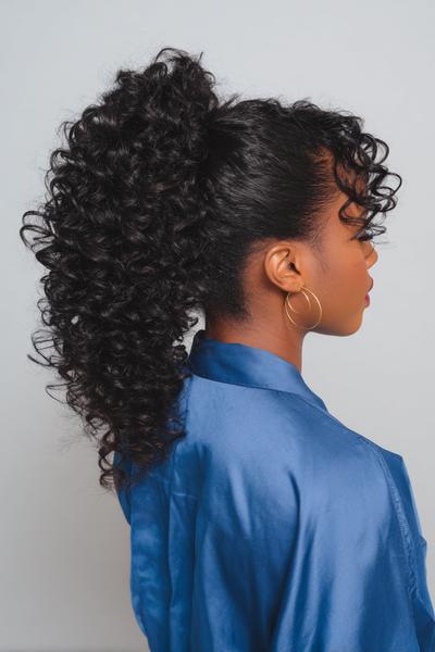 30. Curly Drawstring Pony for Hairstyles for Black Women Ponytail With Bouncy Curls and Soft Tendrils