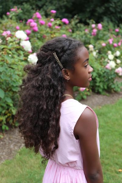 18. Curly Half-Up Barrette Style with Tangle-Free Ends for hairstyles for curly hair for school ideas