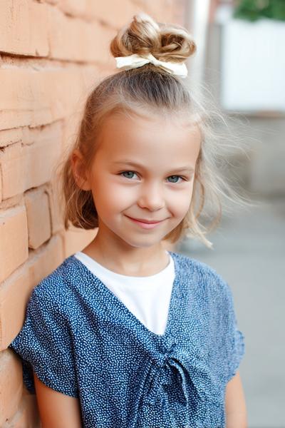 15. Half-Up Top Knot on a Short Cut for hairstyles for kids short hair ideas