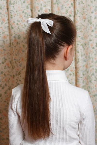 18. Sleek High Ponytail with Wrapped Base for hairstyles for kids for school ideas