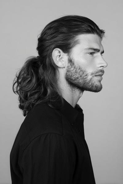 15. Loose Low Ponytail with Beard-Frame Tendrils for hairstyles for long hair men ideas