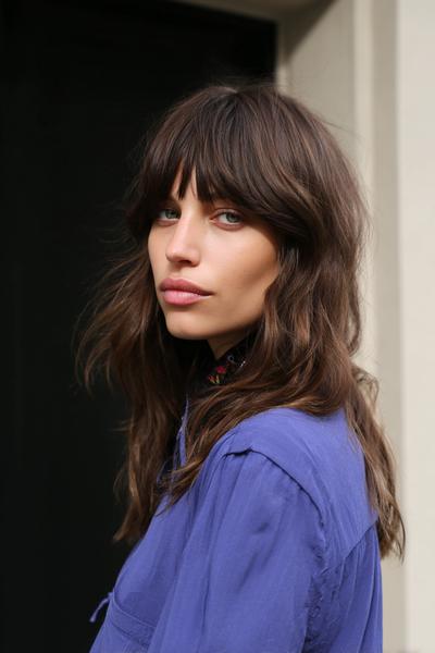 22. Curtain Bangs with a Low, Loose Knot for hairstyles for long hair with bangs ideas