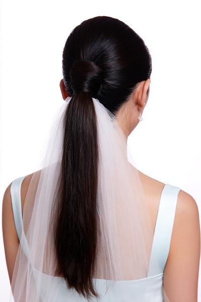 6. Sleek Middle-Part Ponytail with Veil-Friendly Wrap for hairstyles for long hair wedding ideas