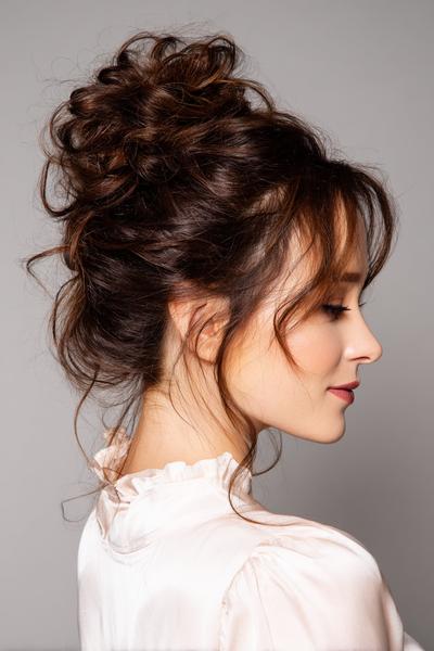 22. Messy High Bun with Face-Framing Tendrils for hairstyles for medium length hair updo ideas