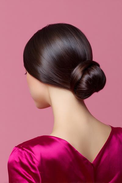 23. Sleek Low Bun with Middle Part and Glass Finish for hairstyles for medium length hair updo ideas