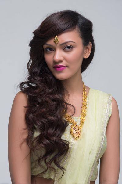 26. Side-Swept Curls with Maang Tikka Placement for hairstyles for medium length hair indian ideas
