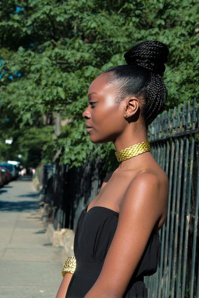17. Sleek Cornrow Bun with Gold Cuffs for hairstyles for school braids black women ideas