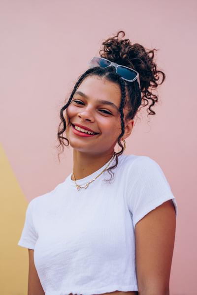 25. Mini Braided Topknot with Soft Curls for hairstyles for school braids short hair ideas