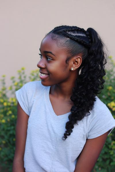19. Side Cornrow into Curly Ponytail for Hairstyles for School Curly Hair Braids with a Shiny Part Line