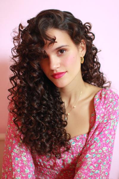 31. Long Curly Side-Swept Style for Hairstyles for School Curly Hair Long with Tucked Pins