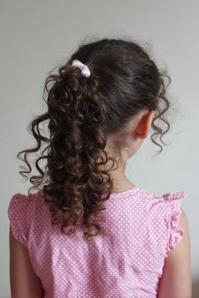 9. Two-Minute Curly Ponytail for Hairstyles for School Curly Hair Easy with a Wrapped Elastic Base