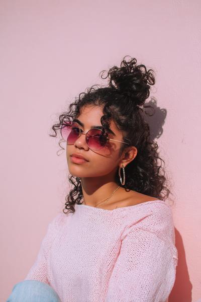 15. Curly Half-Up Top Knot With Loose Tendrils for hairstyles for school down curly hair ideas