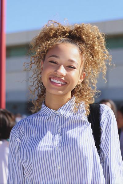 21. Curly High-Crown Puff Half-Up for hairstyles for school down curly ideas