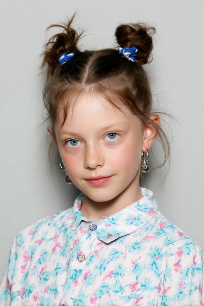 9. Two-Minute Top Knot With Neat Parting for hairstyles for school kids easy ideas