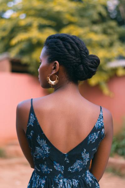 25. Low Chignon Bun with Twisted Sides for Hairstyles for School Natural Hair Bun Elegance