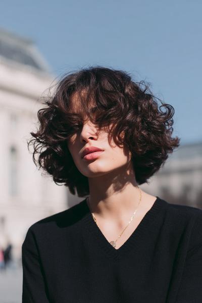 17. Soft Curly Bob with a Deep Part for hairstyles for school short hair curly ideas