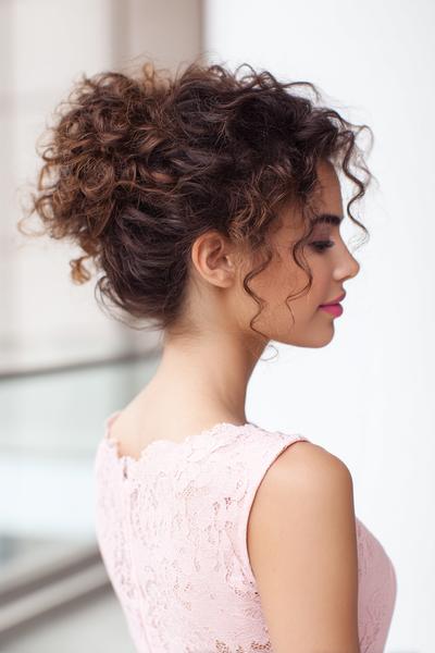 33. Curly Low Bun for Hairstyles for School Up Curly With a Soft, Romantic Shape