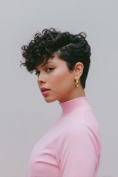 5. Sleek Curly Side-Part Pixie for hairstyles for short hair curly ideas