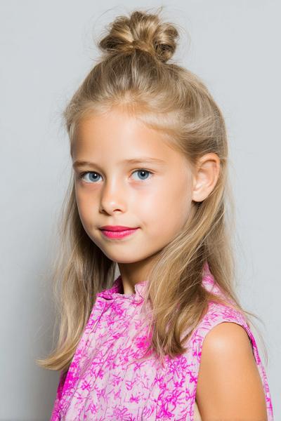 6. Half-Up Top Knot with Face Wisps for hairstyles for thin hair for kids ideas