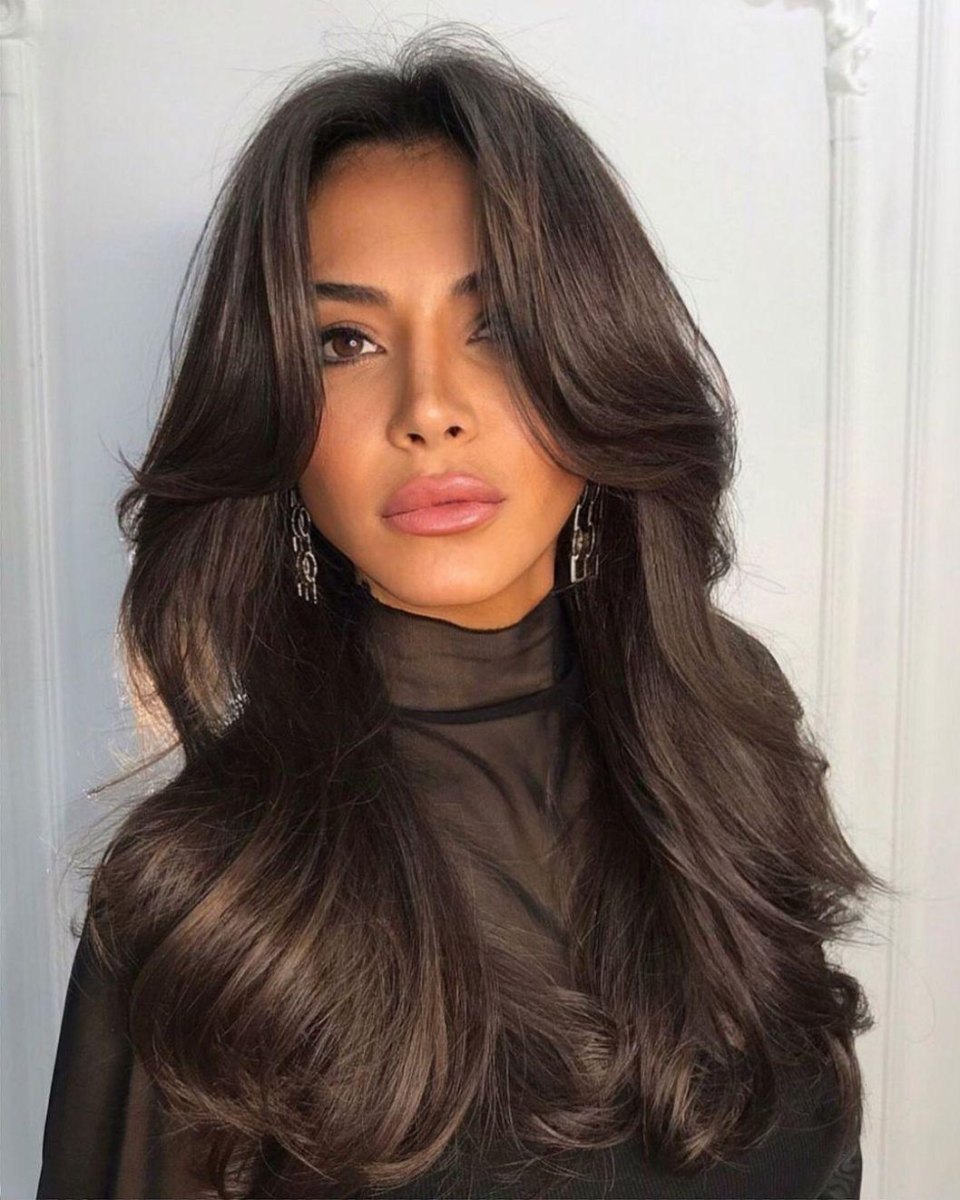 Long blowout layers with soft curtain bangs