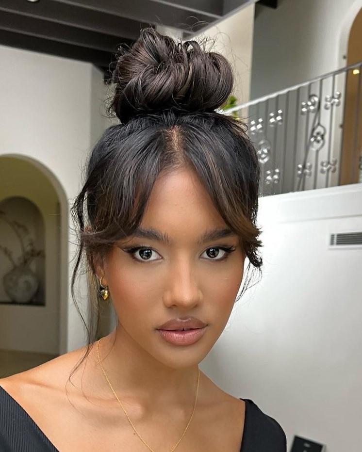 Elevated casual messy high bun updo look