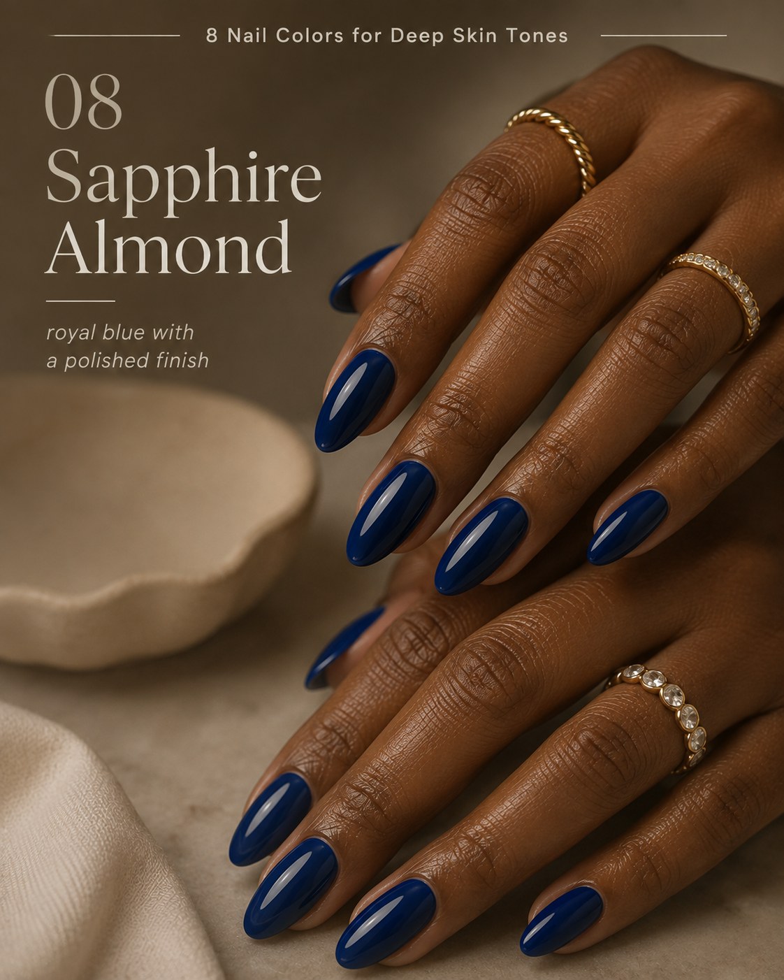 Deep sapphire blue nail color for deep skin tones in a polished glossy almond shape