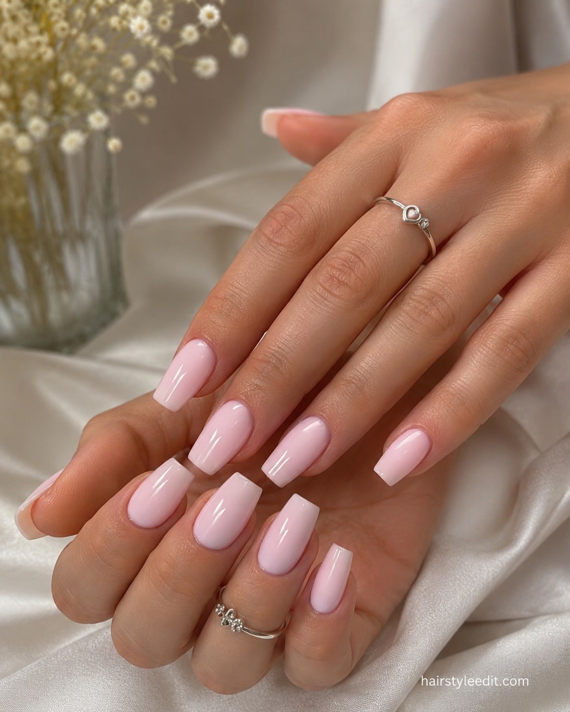 Squared short pink nails with a two-tone glazed finish for a glassy pink look