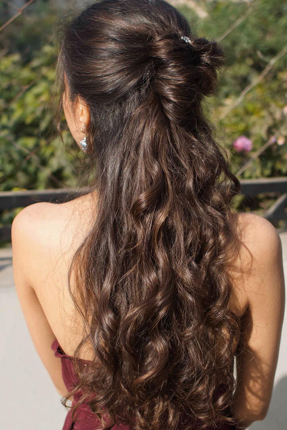 20. Simple Hairstyles for Long Hair: Half-Up Claw Clip With Voluminous Crown