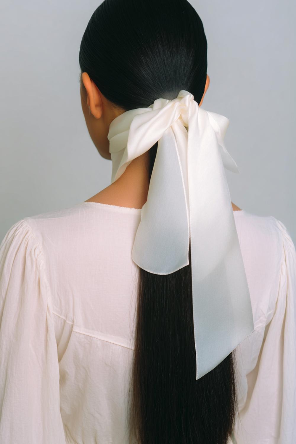 24. Simple Hairstyles for Long Hair: Scarf-Wrapped Ponytail With Satin Ribbon Accent