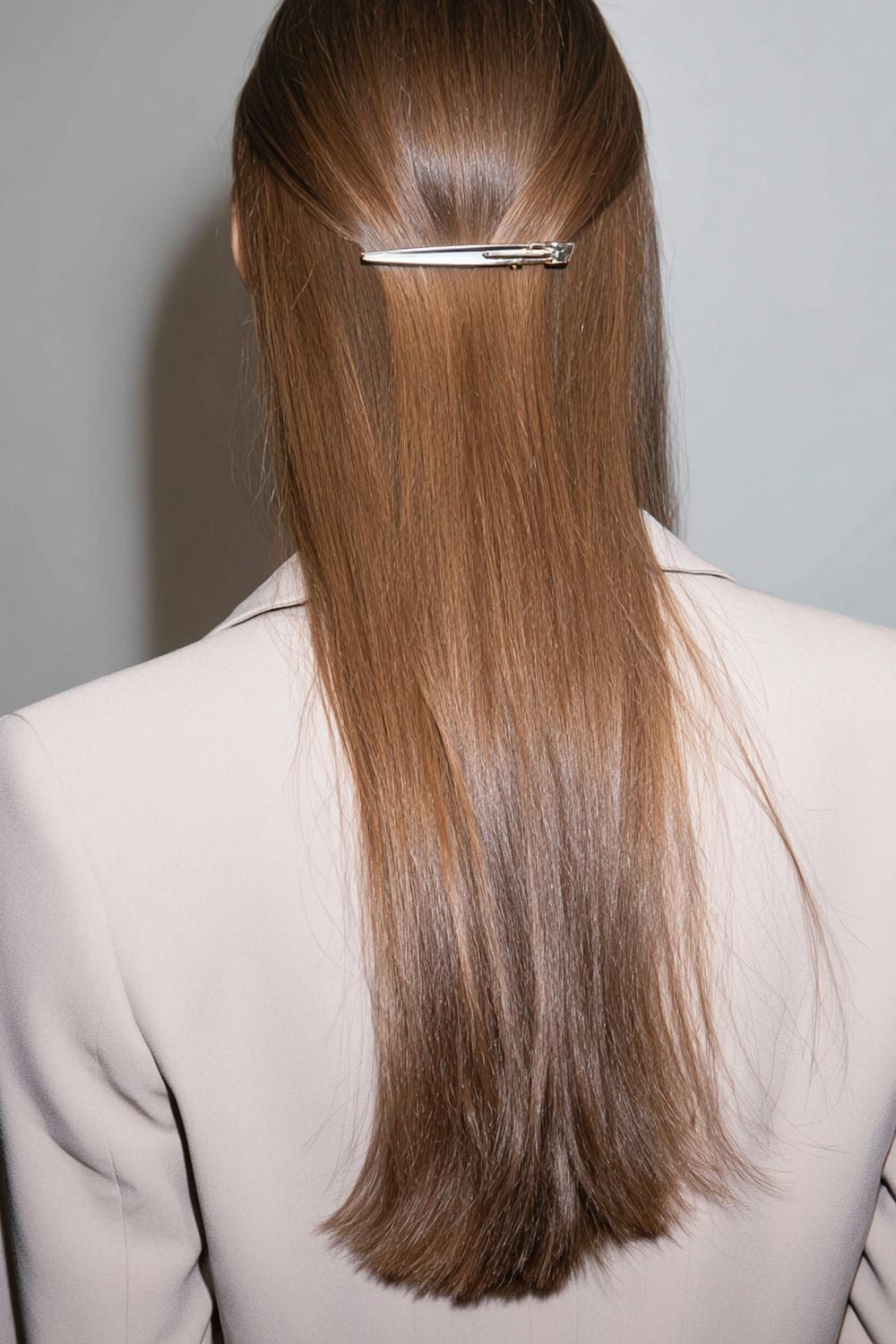 28. Simple Hairstyles for Long Hair: Single Statement Clip With Sleek Back Sections