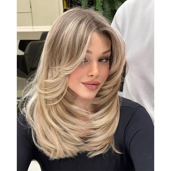 Sleek polished 90s layered blowout