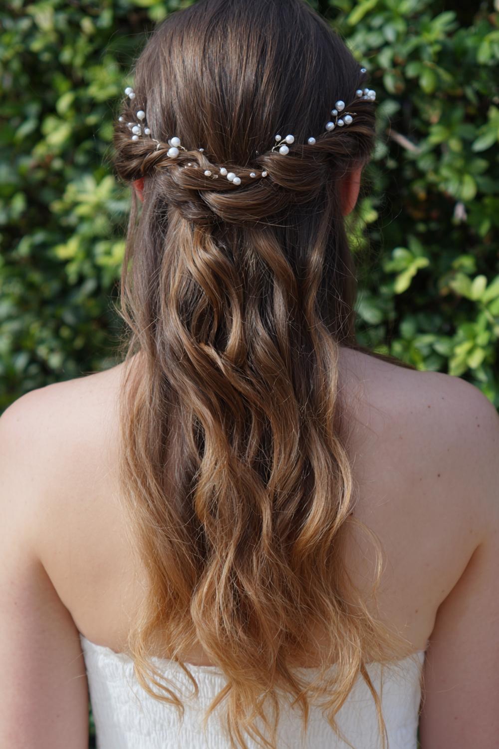 12. Braided Hair Crown with Loose Tendrils and Pearl Pins