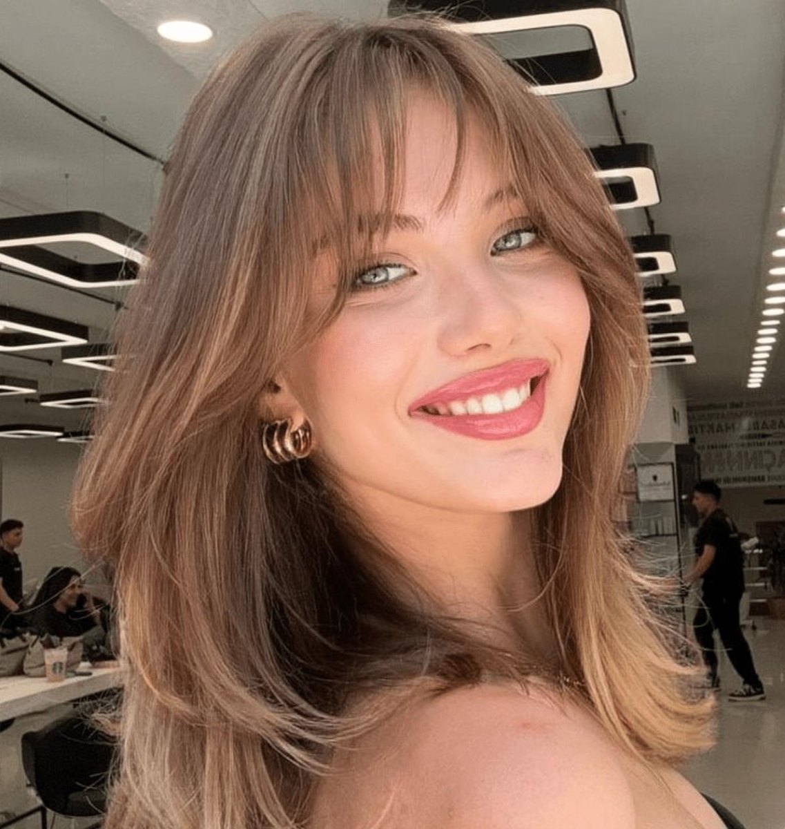 Round face wispy curtain bangs