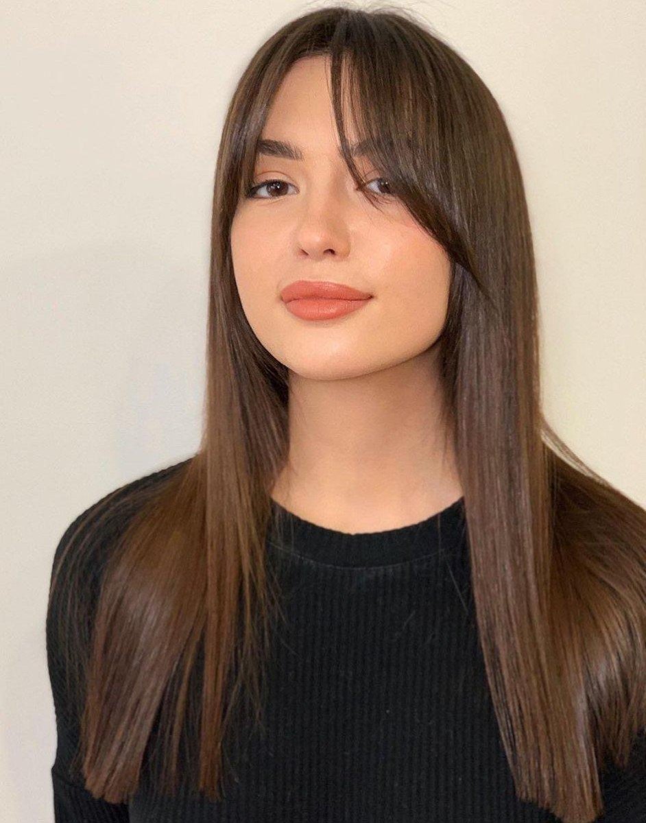 Wispy curtain bangs on straight hair