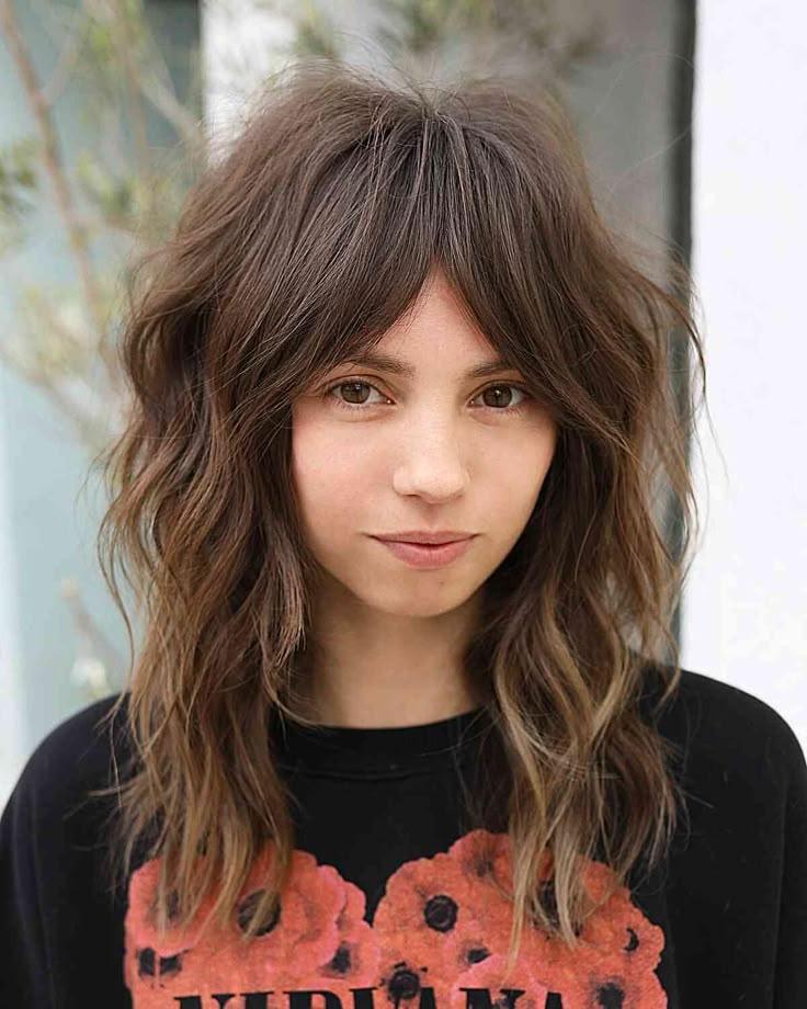 Shag cut with wispy curtain bangs