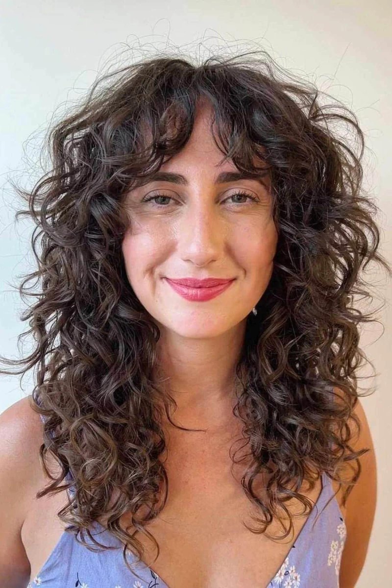 Curly hair wispy curtain bangs