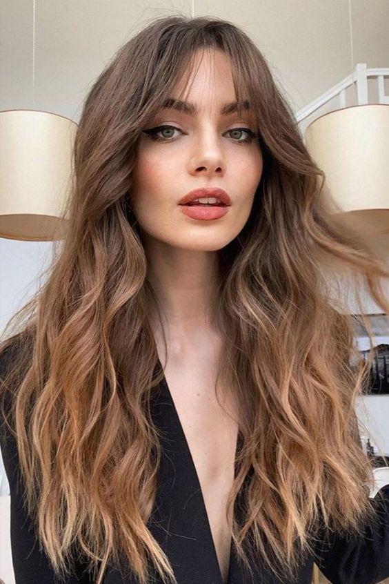 Long waves wispy curtain bangs