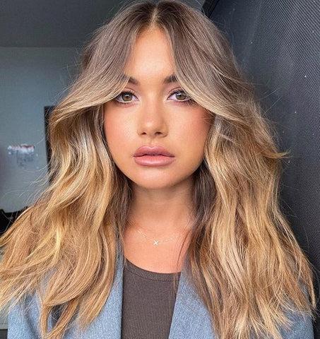 Middle part wispy curtain bangs
